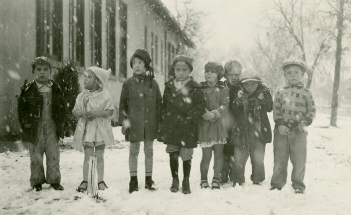 Historic black and white photo of children standing in snow in early 1900s Vegas, capturing the birth of Vegas era.