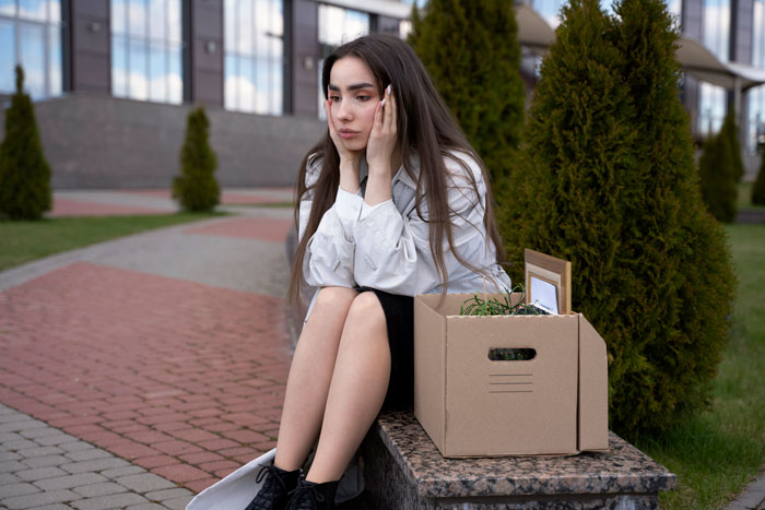 Young woman feeling betrayed and sad sitting outside with a box, reflecting on giving her ex-best friend a taste of her own medicine. Young woman feeling betrayed and sad sitting outside with a box, reflecting on giving her ex-best friend a taste of her own medicine.