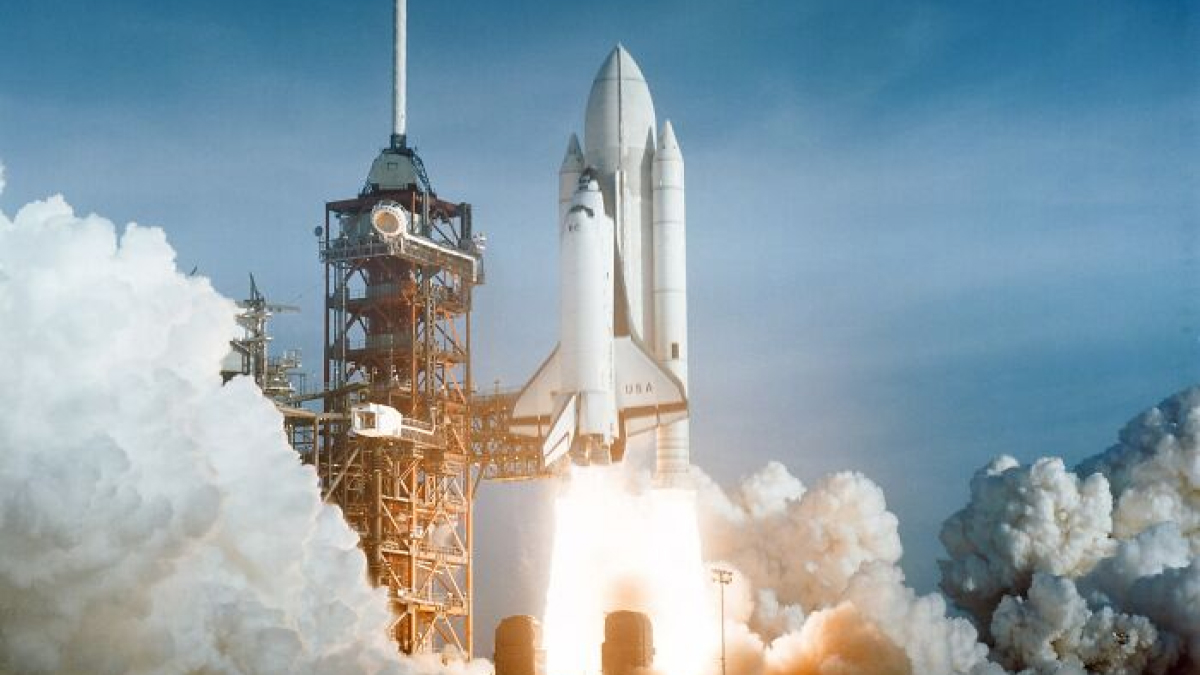 Space shuttle launching with smoke and fire, showcasing record-breaking inventions that move at mind-blowing speeds.