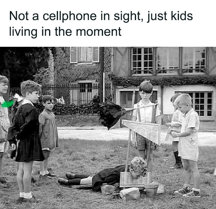 Black and white image of kids playing outside, captioned about living in the moment without cellphones, creepy but funny meme.