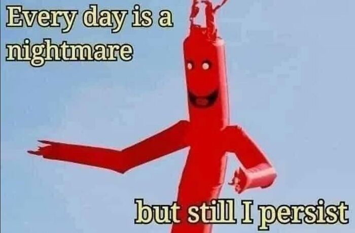 Red inflatable tube man with a creepy smile and text about nightmares, fitting creepy funny memes for humor lovers.