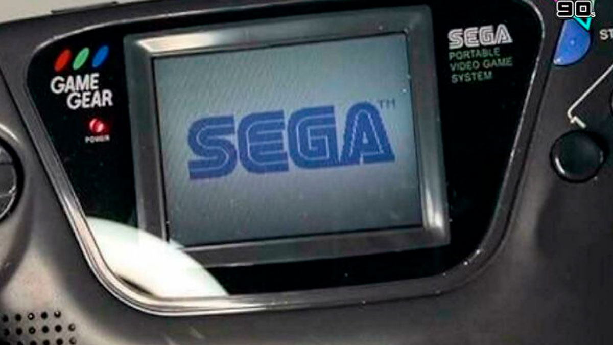 Close-up of a Sega Game Gear handheld console screen displaying the SEGA logo from the 90s gaming era.