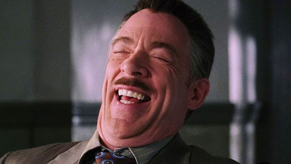 Man with mustache laughing heartily, expressing an immaculate sense of humor related to product and service reviews.