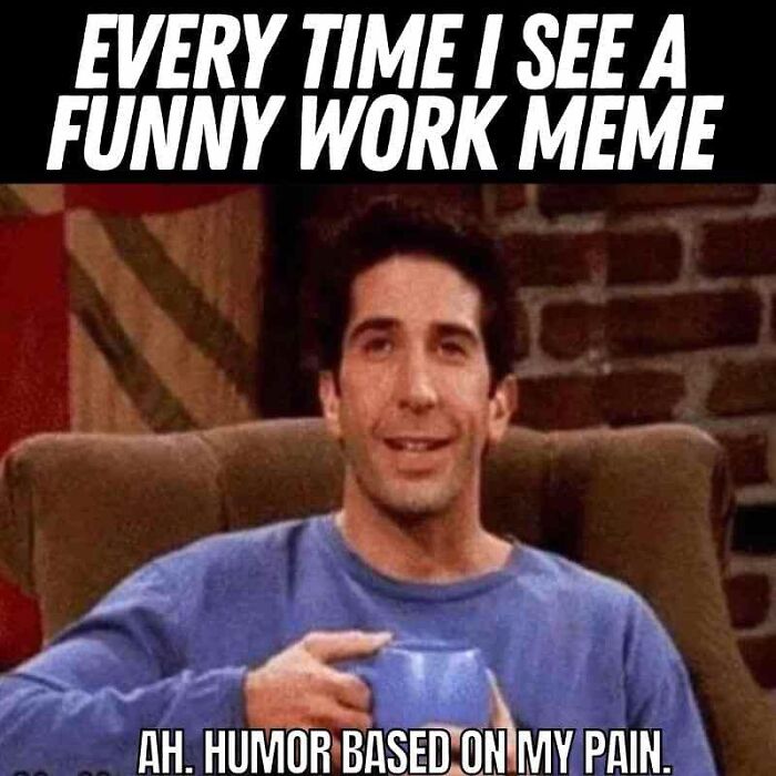 Man smiling while holding a blue mug with a caption about funny work memes and humor based on pain.