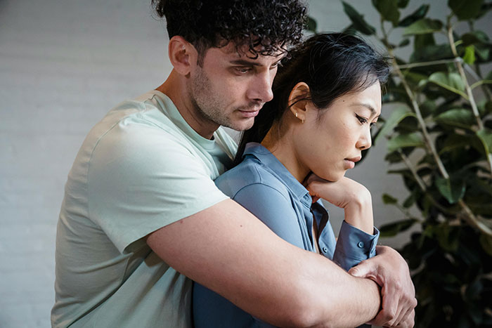 Concerned couple in a supportive embrace, reflecting stress and worry linked to grandma threaten cps unborn baby situation. Concerned couple in a supportive embrace, reflecting stress and worry linked to grandma threaten cps unborn baby situation.