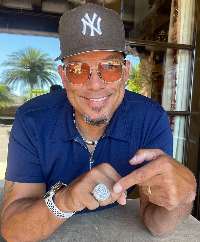 Man wearing a New York Yankees cap and sunglasses smiling while pointing at a large ring, related to Halle Berryâs ex-husband controversy. Man wearing a New York Yankees cap and sunglasses smiling while pointing at a large ring, related to Halle Berryâs ex-husband controversy.