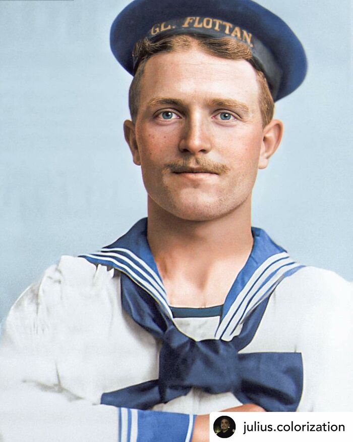 Victorian man in naval uniform with blue eyes and mustache, representing handsome Victorian men from history.