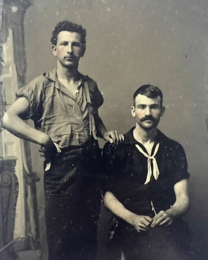 Two handsome Victorian men posing in vintage clothing, showcasing classic style and charm from the Victorian era.