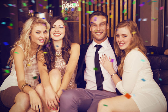 Group of young adults celebrating indoors with confetti, capturing a moment related to wife surprise visitor and pregnancy claim. Group of young adults celebrating indoors with confetti, capturing a moment related to wife surprise visitor and pregnancy claim.