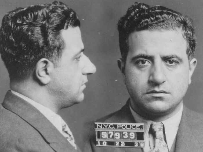 Black and white vintage mugshot of a notorious mob boss, showing front and side profiles with police identification.