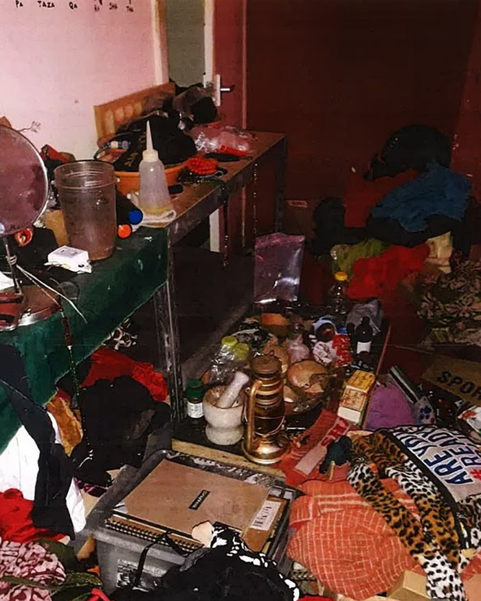 Cluttered room with various household items and clothing scattered, highlighting signs ignored in toddler vegan diet case. Cluttered room with various household items and clothing scattered, highlighting signs ignored in toddler vegan diet case.