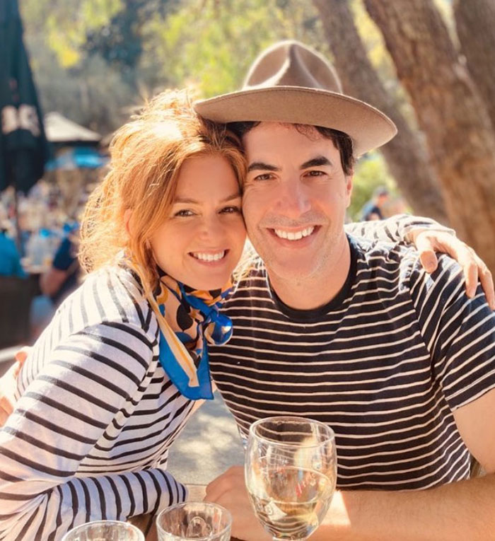Isla Fisher smiling with Sasha Baron Cohen outdoors, reflecting on tough couple of years amid relationship split. Isla Fisher smiling with Sasha Baron Cohen outdoors, reflecting on tough couple of years amid relationship split.