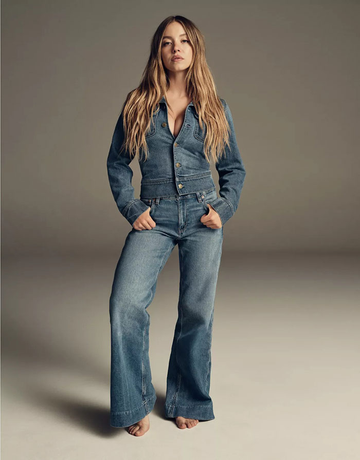 Woman wearing a denim jacket and wide-leg jeans in a Gap jeans ad responding to American Eagle campaign. Woman wearing a denim jacket and wide-leg jeans in a Gap jeans ad responding to American Eagle campaign.