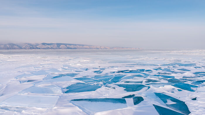 Large Ice Plates On Lake Baikal Under A Soft Siberian Sky