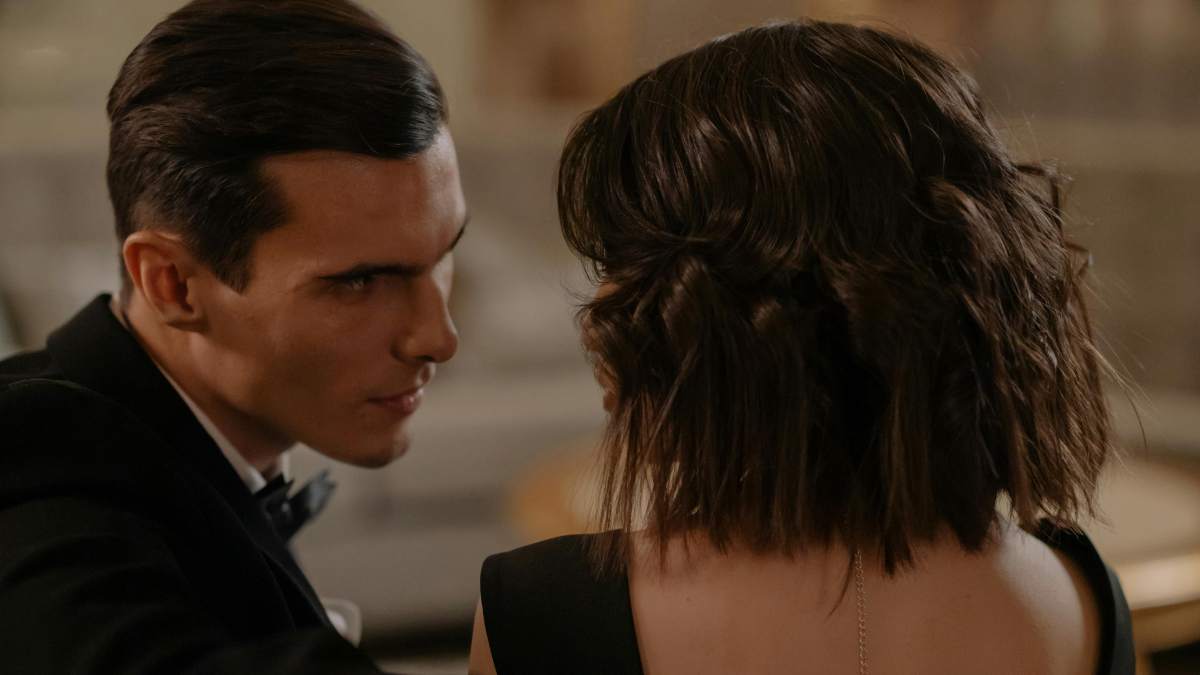 Man and woman in formal wear sharing a private moment, illustrating IFS data on men cheating more with closing gender gap.