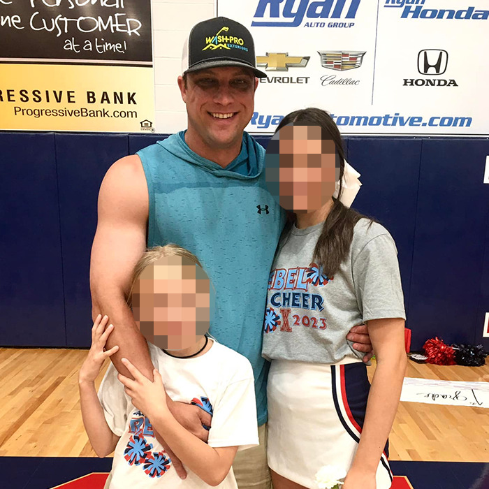 Man with two children in a gym, blurred faces, related to father-of-two assault after breast milk dispute news. Man with two children in a gym, blurred faces, related to father-of-two assault after breast milk dispute news.