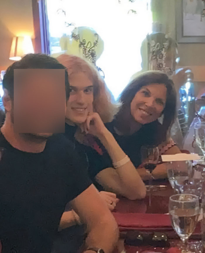 Three people sitting at a restaurant table, with the Minneapolis school attacker’s mother among them, blurred face visible. Three people sitting at a restaurant table, with the Minneapolis school attacker’s mother among them, blurred face visible.