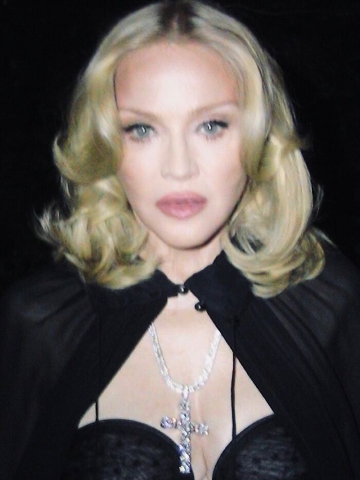 Blonde woman with curled hair wearing a black outfit and a large cross necklace amid Maxim backlash over unattractive women list. Blonde woman with curled hair wearing a black outfit and a large cross necklace amid Maxim backlash over unattractive women list.