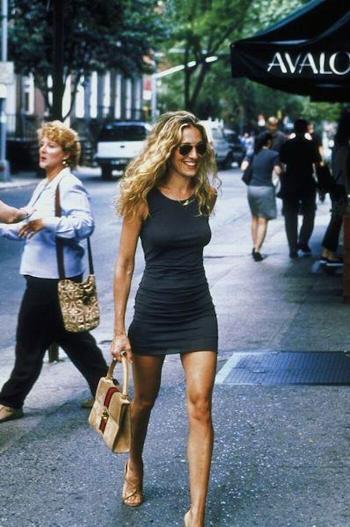 Woman in a black dress walking on a city street, related to Maxim most unattractive women list backlash. Woman in a black dress walking on a city street, related to Maxim most unattractive women list backlash.