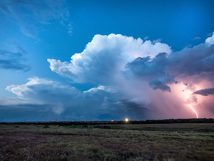 Dark storm clouds with lightning strike over an open field, illustrating a dramatic and smelly sewage disaster scene. Dark storm clouds with lightning strike over an open field, illustrating a dramatic and smelly sewage disaster scene.