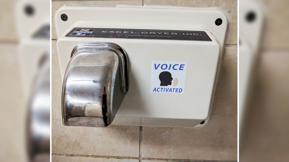 Voice activated hand dryer mounted on tiled wall as a featured product approved by Bored Panda hive mind.