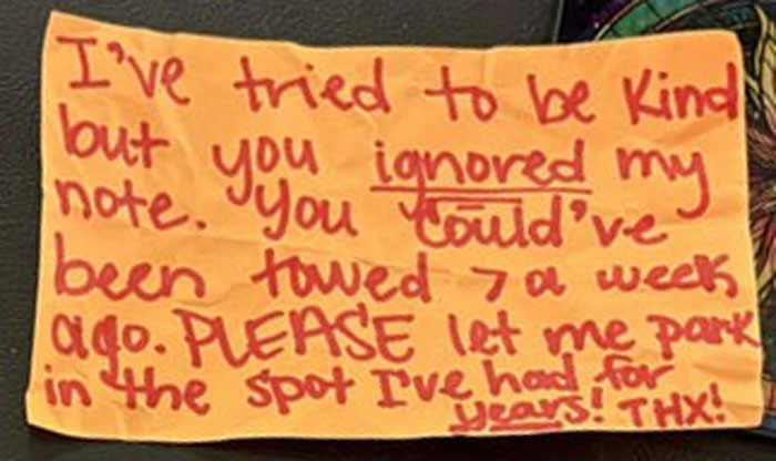 Handwritten anonymous note from dodgy neighbor trying to trick woman into giving up her parking spot.