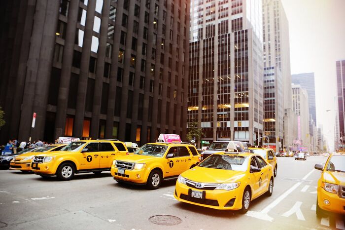 Yellow taxis lined up on a city street among tall buildings, illustrating PR campaigns and decisions that were complete fails.