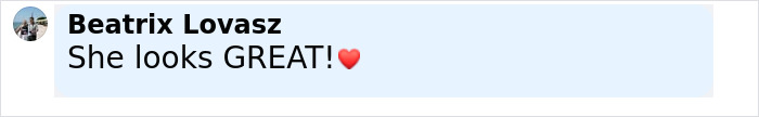Comment reading She looks GREAT with a red heart emoji, posted by Beatrix Lovasz in a social media interface. Comment reading She looks GREAT with a red heart emoji, posted by Beatrix Lovasz in a social media interface.