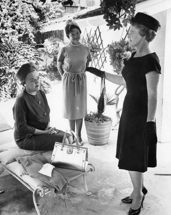 Three LA women dressed stylishly in 1960s fashion, socializing outdoors and enjoying life in 1962.