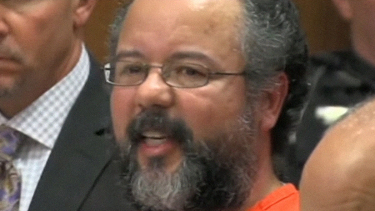 Man with glasses and beard in a courtroom, capturing a real-life terror moment after being thought paranoid.
