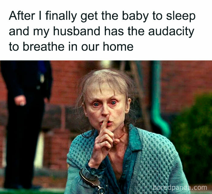 Tired woman making a shushing gesture with finger to lips, illustrating funny parenting memes about real parenting struggles.