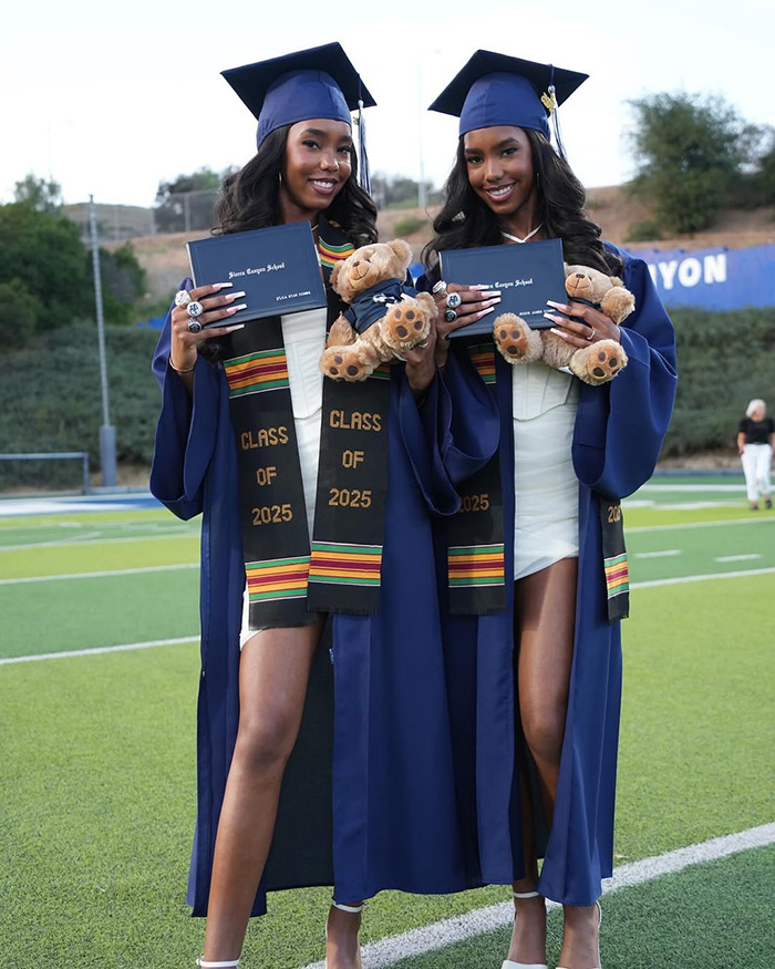 Sean Diddy's twin daughters in graduation caps and gowns holding diplomas and teddy bears celebrating their achievement. Sean Diddy's twin daughters in graduation caps and gowns holding diplomas and teddy bears celebrating their achievement.