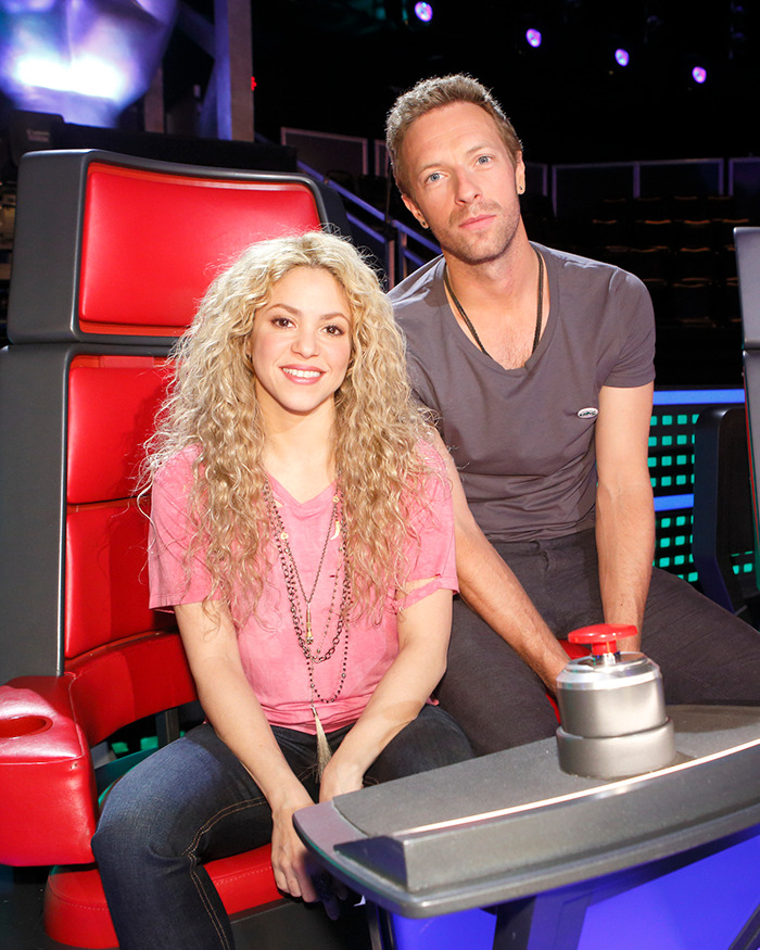 Shakira and Chris Martin seated together onstage during a show, sparking fans to speculate on their romance. Shakira and Chris Martin seated together onstage during a show, sparking fans to speculate on their romance.