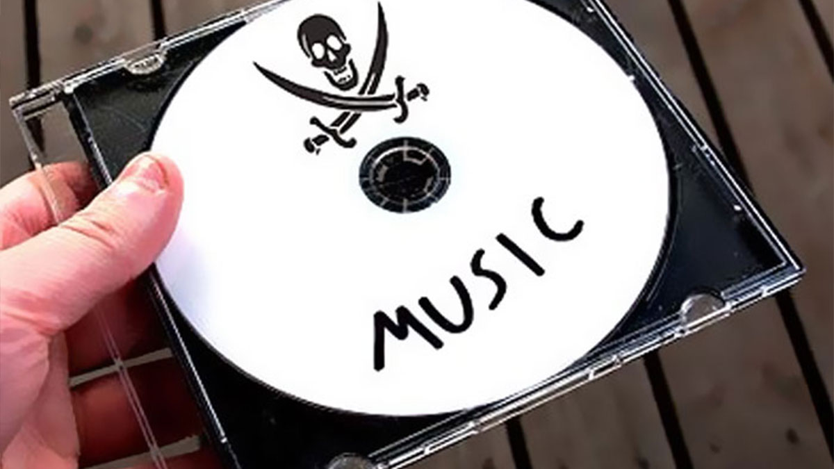 Hand holding a music CD with pirate skull and crossbones, symbolizing illegal activities like drive over the speed limit.