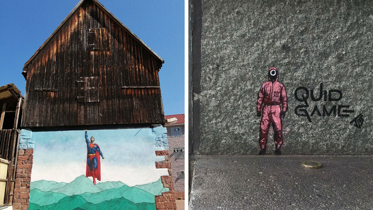 Graffiti street art interacts with surroundings showing Superman lifting building and a Squid Game character next to a coin.