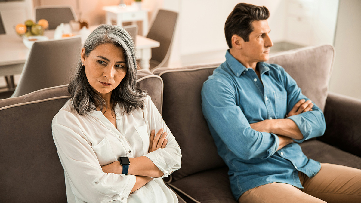Wife humiliates husband by unleashing years of resentment during tense moment on couch at home.