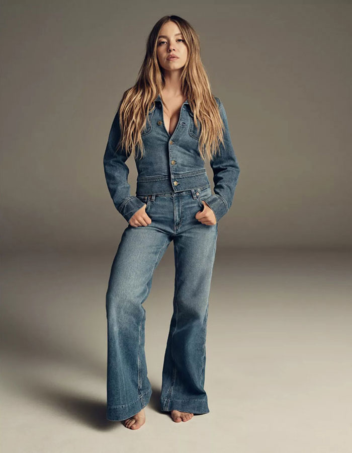 Sydney Sweeney posing barefoot in denim jacket and jeans, showcasing a bold fashion choice amid genes with bad taste discussions. Sydney Sweeney posing barefoot in denim jacket and jeans, showcasing a bold fashion choice amid genes with bad taste discussions.