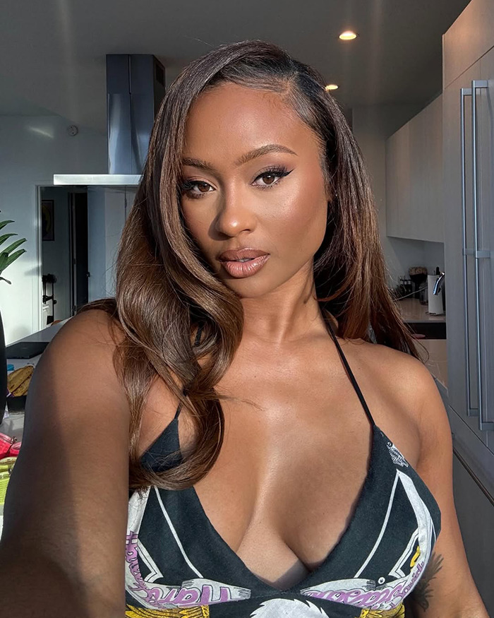 Travis Kelce's ex in a close-up selfie wearing a black top, breaking silence after Taylor Swift engagement news. Travis Kelce's ex in a close-up selfie wearing a black top, breaking silence after Taylor Swift engagement news.