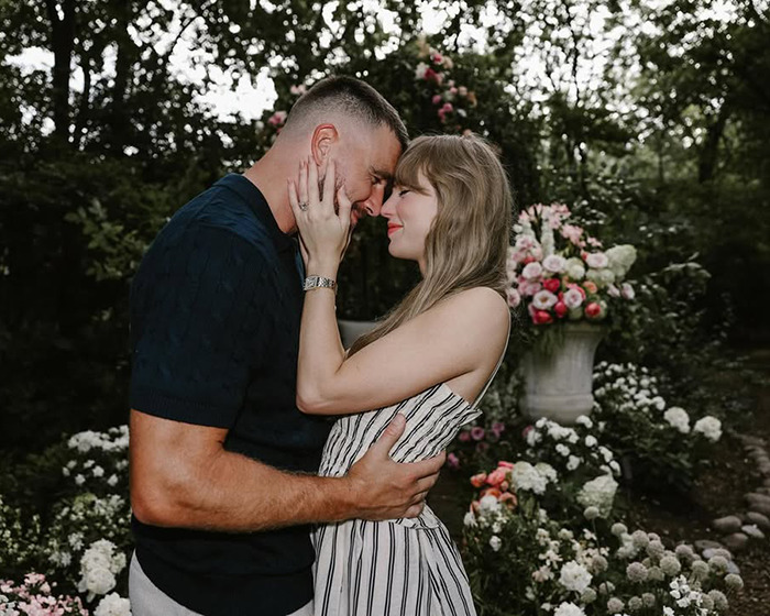 Couple embracing closely in a garden filled with flowers, capturing an intimate and romantic moment. Couple embracing closely in a garden filled with flowers, capturing an intimate and romantic moment.