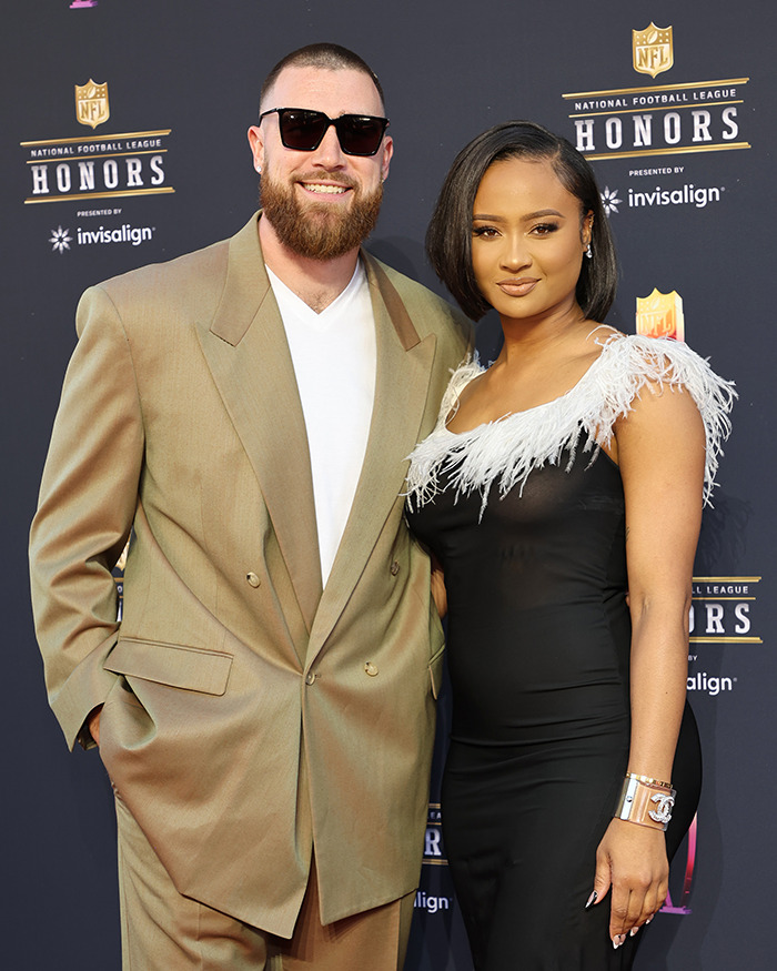 Travis Kelce and his ex posing on the red carpet at the NFL Honors event, dressed in formal attire. Travis Kelce and his ex posing on the red carpet at the NFL Honors event, dressed in formal attire.
