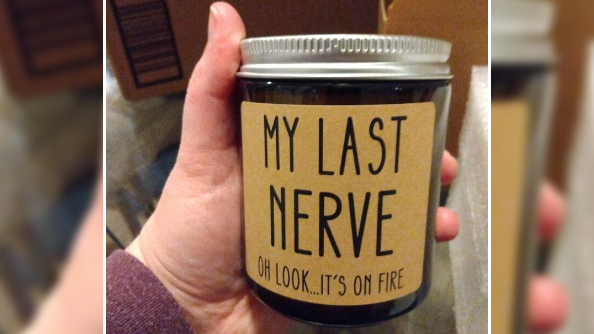 Hand holding a trending Amazon add to cart-worthy candle with label reading My Last Nerve on fire.