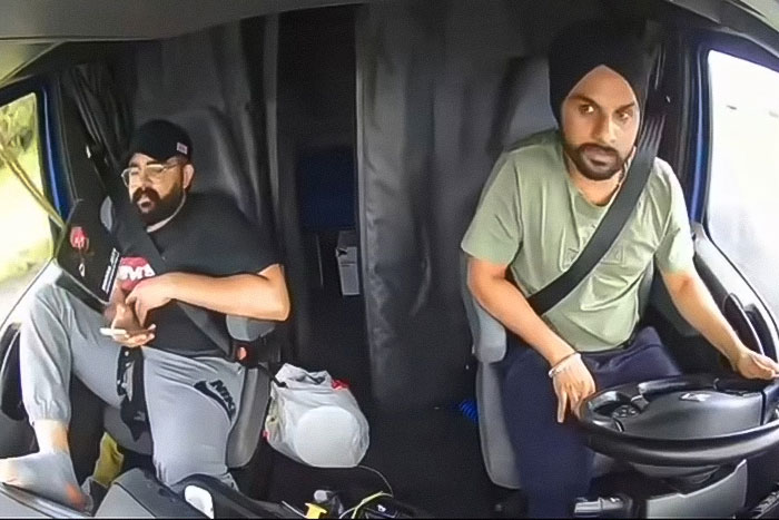 Two truck drivers inside the cabin, one making an illegal U-turn contributing to a fatal accident with three lives lost. Two truck drivers inside the cabin, one making an illegal U-turn contributing to a fatal accident with three lives lost.