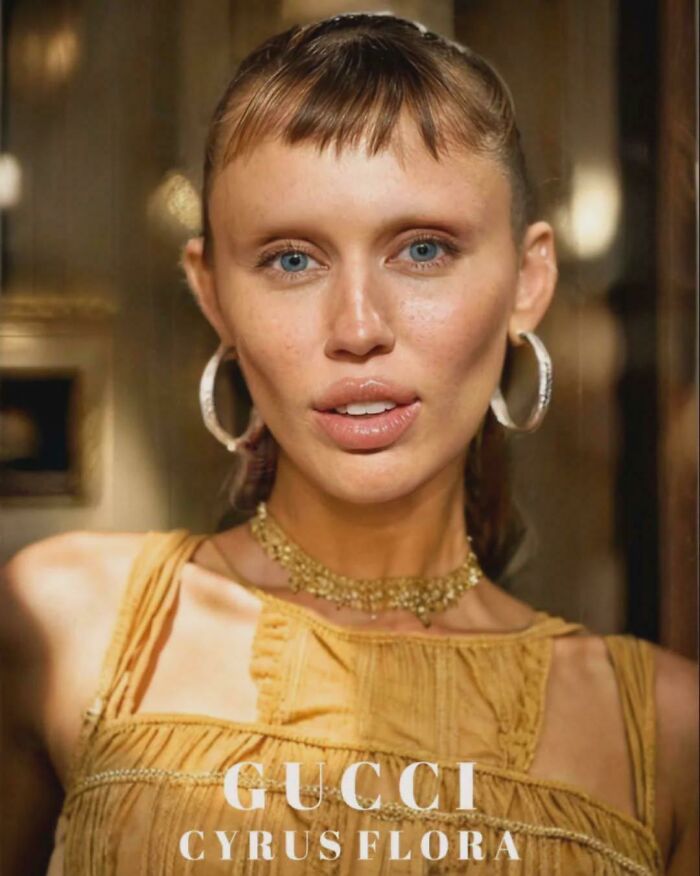 Close-up of a woman with minimal eyebrows wearing hoop earrings and a yellow top, highlighting the trend of no eyebrows. Close-up of a woman with minimal eyebrows wearing hoop earrings and a yellow top, highlighting the trend of no eyebrows.