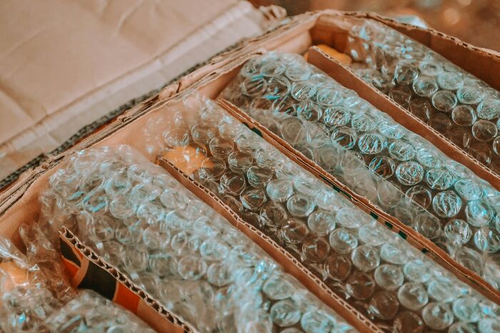 Cardboard dividers wrapped in bubble wrap inside a box demonstrating ingenious inventions repurposed over years