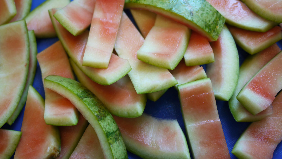 Watermelon rinds sliced on a blue surface, representing snooping parents who accidentally uncovered a side of their teen.