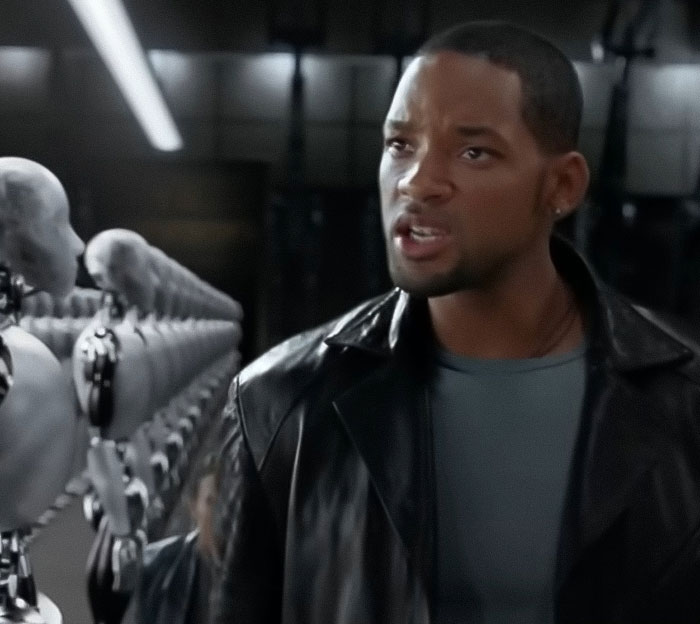Will Smith's co-actor in a tense scene with robots, highlighting bombshell claim about studio publicity removal. Will Smith's co-actor in a tense scene with robots, highlighting bombshell claim about studio publicity removal.