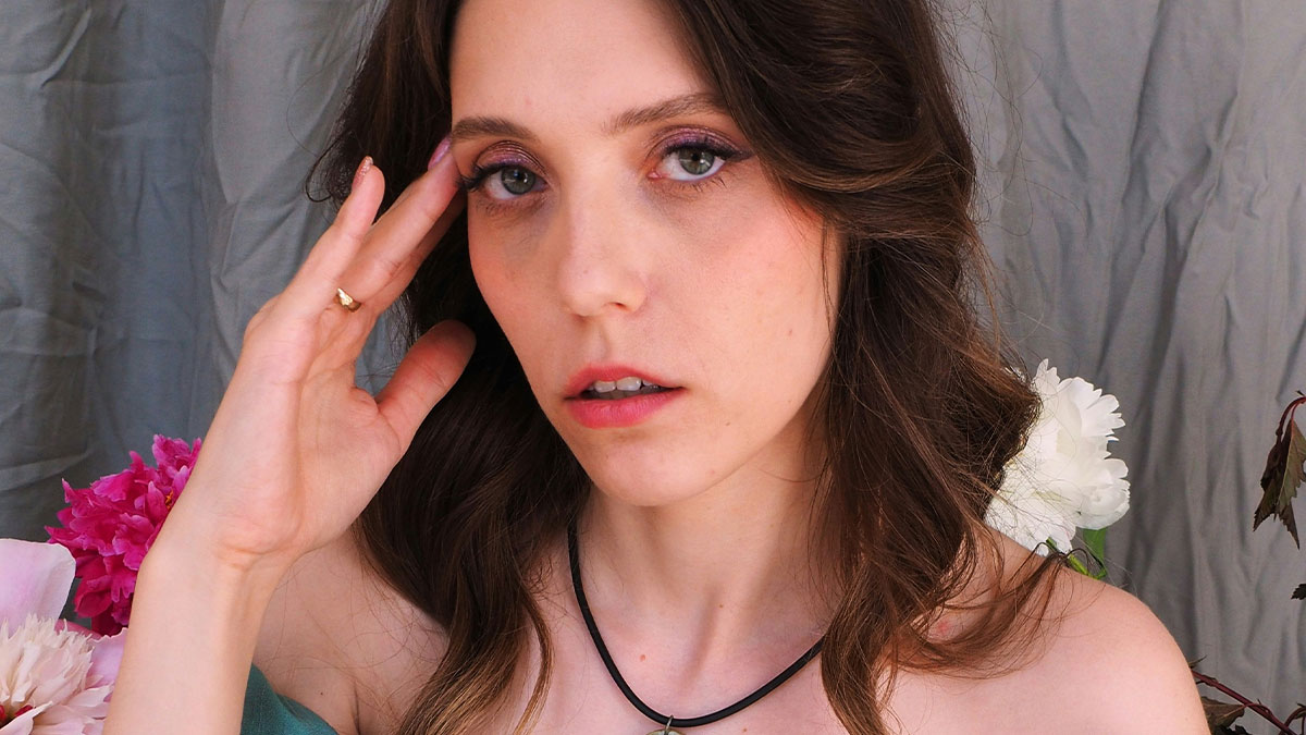 Woman looking frustrated and overwhelmed, expressing emotions related to coworker helping herself to her food at work.