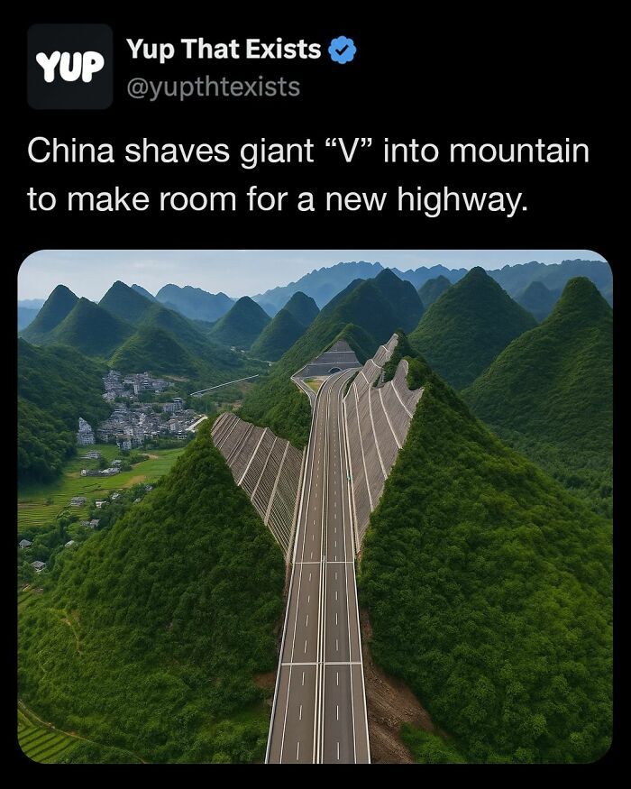A giant V-shaped cut in a mountain in China creates space for a new highway surrounded by green hills.