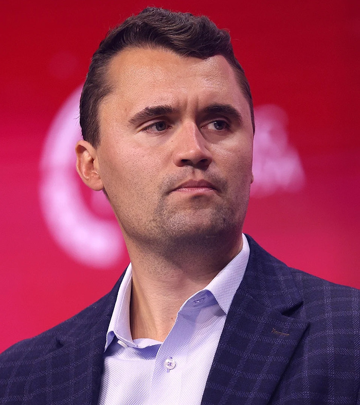 Man in dark blazer and light shirt looking to the side, related to commentator fired after unacceptable Charlie Kirk remarks. Man in dark blazer and light shirt looking to the side, related to commentator fired after unacceptable Charlie Kirk remarks.