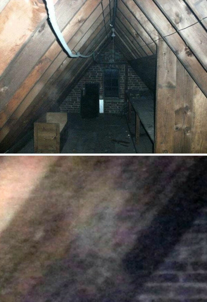 Dimly lit attic with wooden beams and an old brick wall, evoking strange and unexplained histories atmosphere.